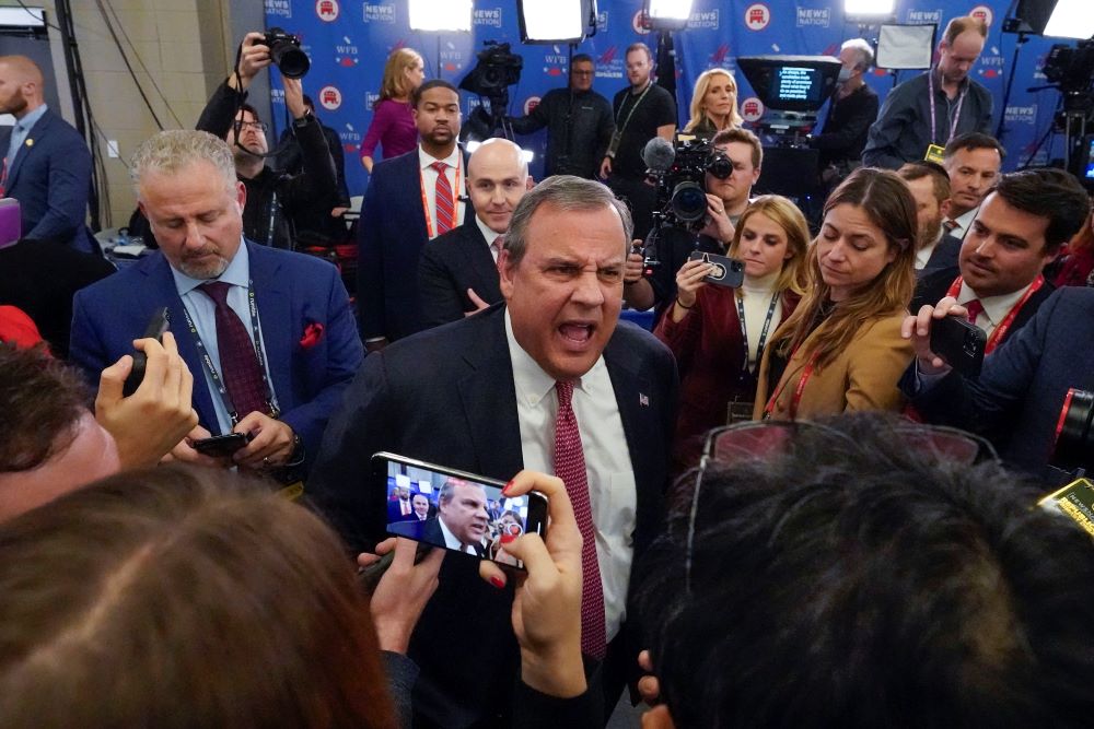 Republican presidential candidate former New Jersey Gov. Chris Christie speaking to members of the media in the Spin Room after participating in the Republican presidential primary debate hosted by NewsNation on Dec. 6 at the Moody Music Hall at the University of Alabama in Tuscaloosa, Ala. (AP/Gerald Herbert)