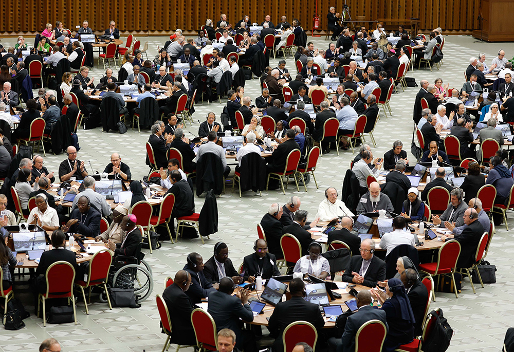 Members of the assembly of the Synod of Bishops start a working session in the Vatican's Paul VI Audience Hall Oct. 18, 2023. (CNS/Lola Gomez)