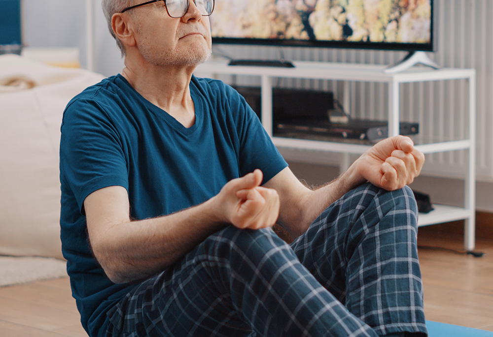 Old man meditating (Dreamstime/Dragoscondrea)