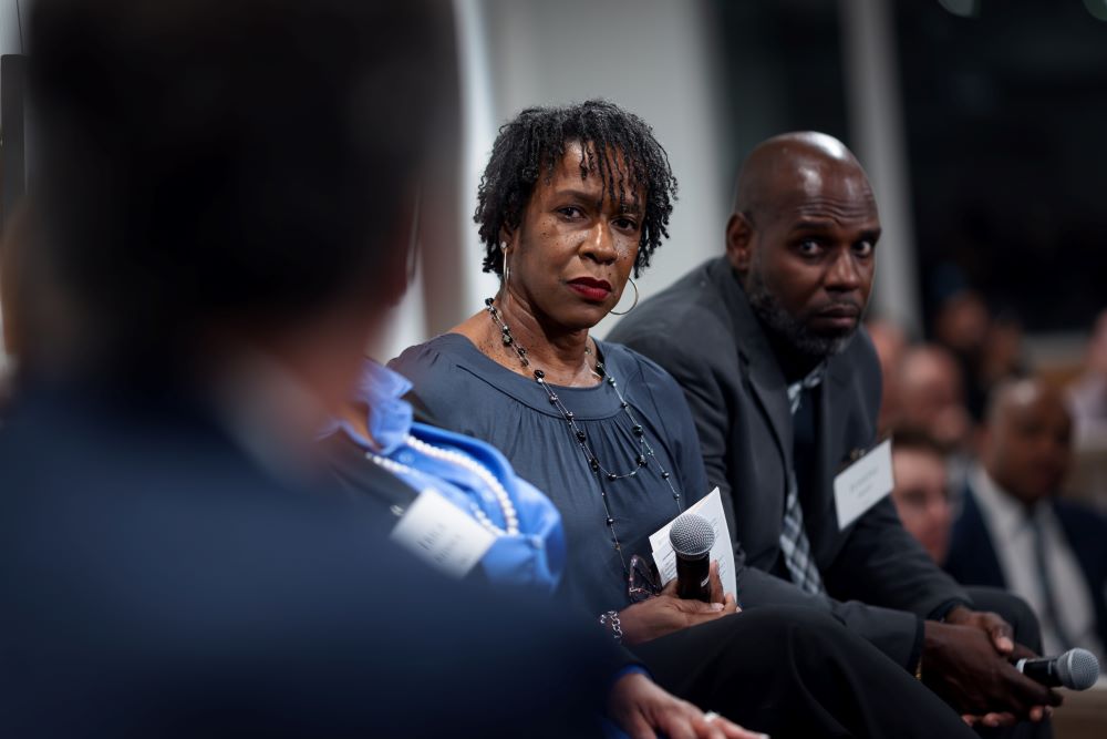 Lisa Daniels listens as Cook County Sheriff Tom Dart speaks at a Catholic Criminal Justice Reform Network event on Feb. 21 in Chicago.