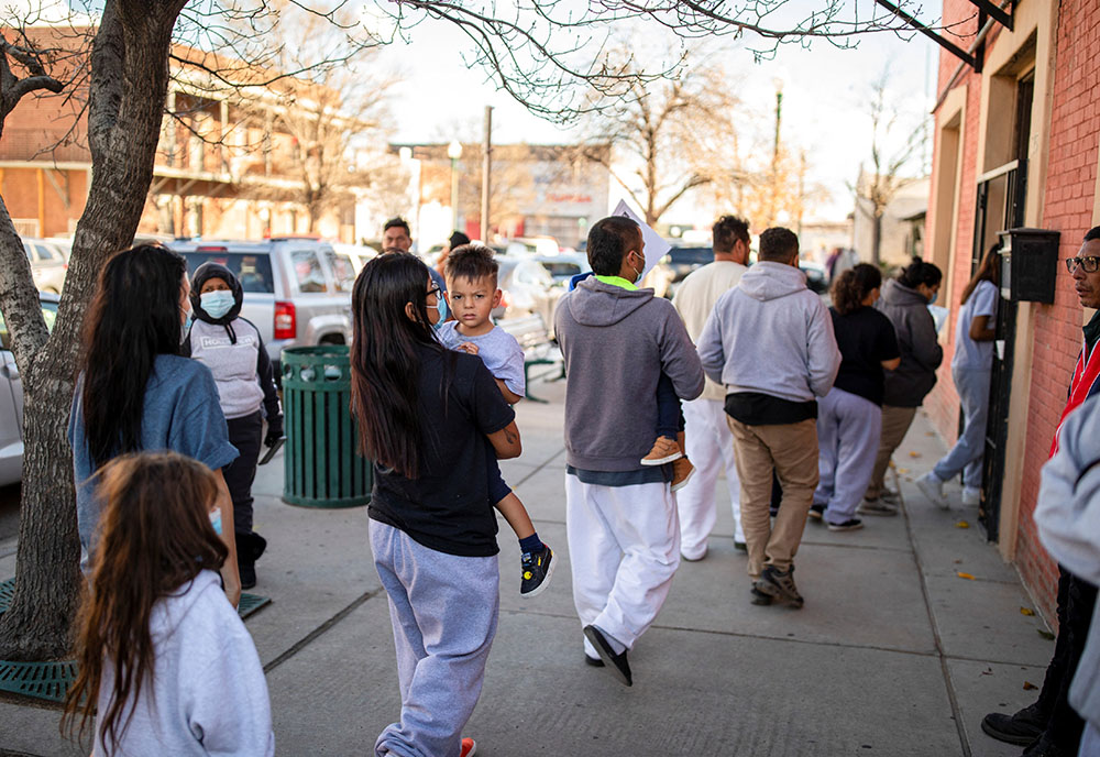 A family of migrants is dropped off by a transport contractor for U.S. Customs and Border Protection at a shelter run by Annunciation House in downtown El Paso, Texas, Dec. 13, 2022. (OSV News/Reuters/Ivan Pierre Aguirre)