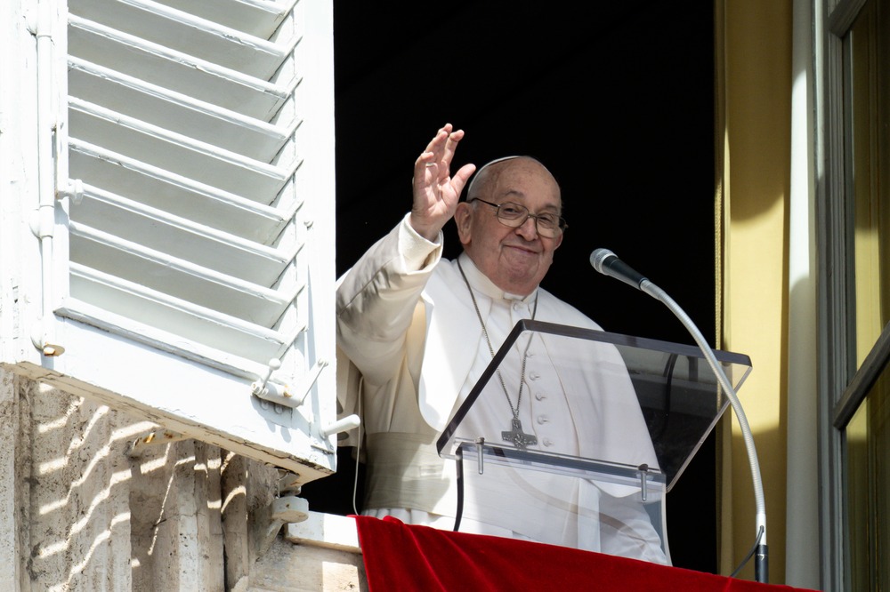 Pope Francis waves from St. Peter's