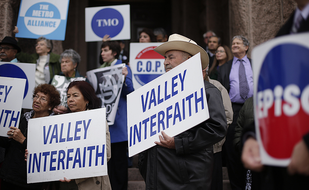 Supporters of Texas Industrial Areas Foundation affiliate groups gather on the steps of the Texas state capitol for a rally in support of Medicaid expansion, Wednesday, Feb. 20, 2013, in Austin. (AP/Eric Gay)