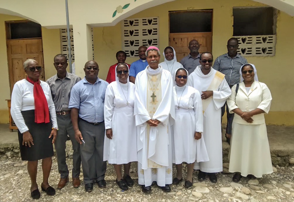 Bishop Joseph Gontrand Décoste of Jérémie, Haiti, with local diocesan priests and nuns (Courtesy of Joseph Gontrand Décoste)