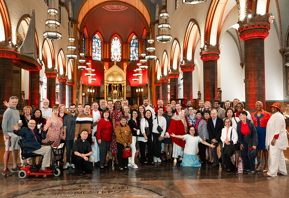 Paulist Fr. Chris Lawton with a group of friends and parishioners after his first Mass, on May 19 (Courtesy of Zachera Wollenberg)