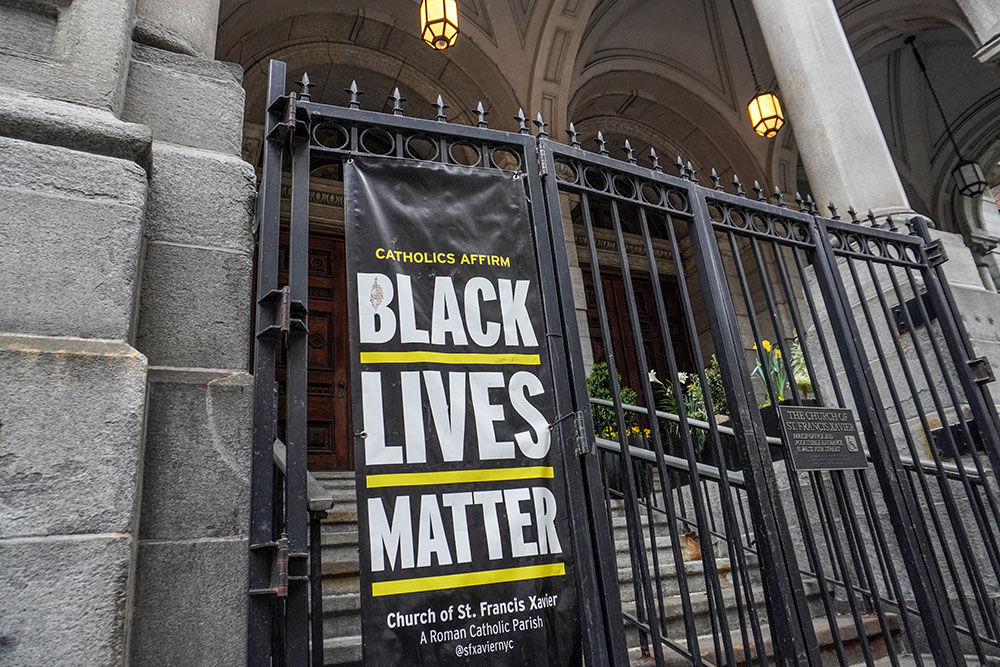 A banner dedicated to the Black Lives Matter movement hangs outside the Church of St. Francis Xavier in Manhattan, New York. (NCR photo/Camillo Barone)
