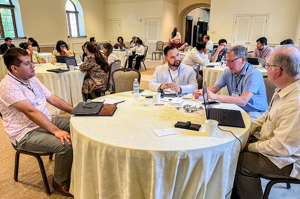 Senior and junior theologians shared the tables with younger scholars and students — each reflection moment was designed to raise dialogue and keep the conversation going. From left: Leo Mendoza, doctoral student at Loyola University Chicago; César (CJ) Baldelomar, doctoral candidate at Boston College; University of Notre Dame Professor Timothy Matovina; and St. Martin's University Professor Ramón Luzárraga. (Luis Donaldo González)