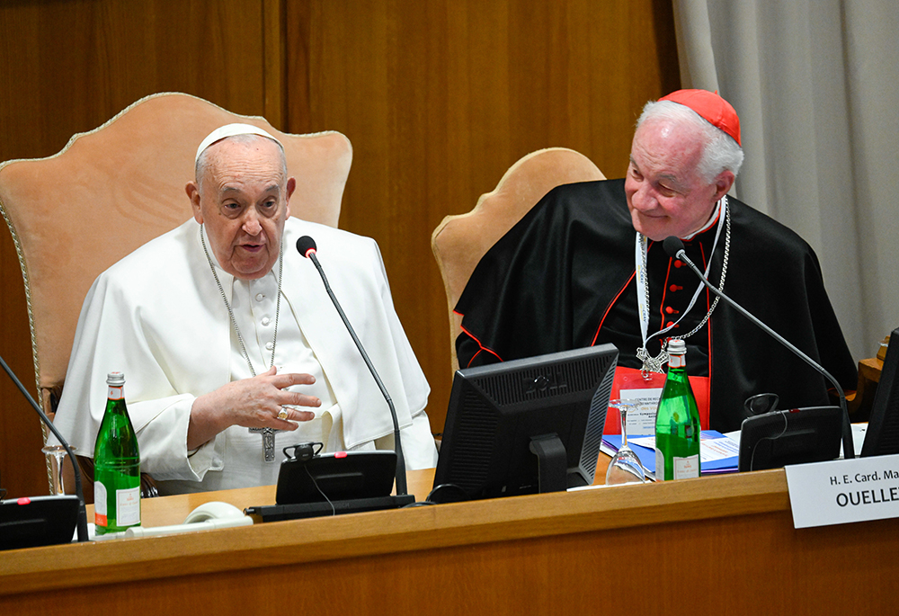 Pope Francis, seated next to Cardinal Marc Ouellet, head of the Center for Research and Anthropology of Vocations and former prefect of the Dicastery for Bishops, addresses attendees at an international congress titled, "Man-Woman: Image of God. For an Anthropology of Vocations," March 1 in the Vatican's Synod Hall. (CNS/Vatican Media)