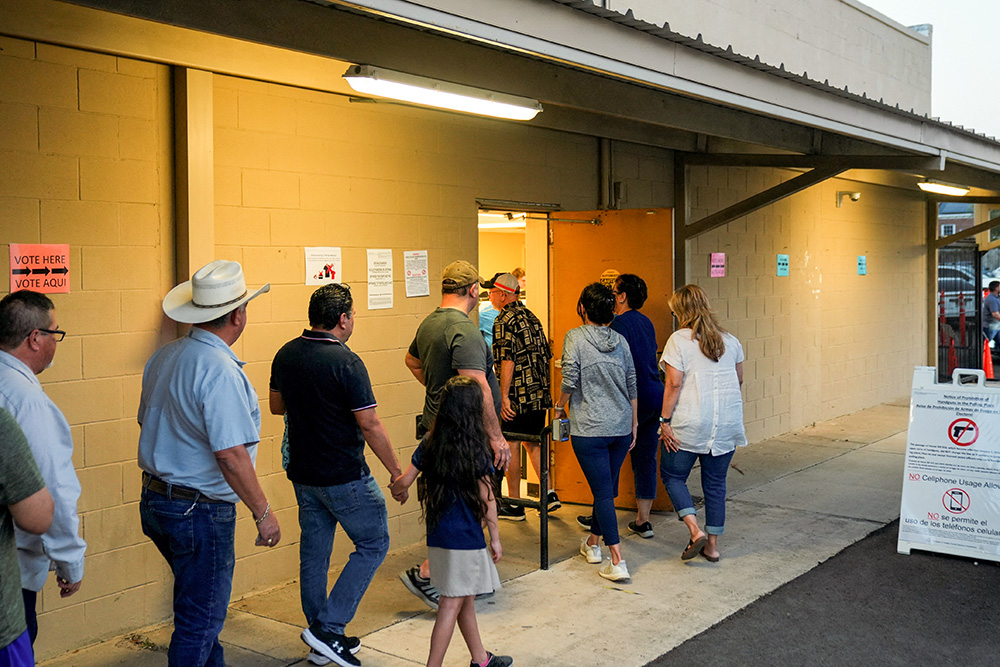 People stand in a line to vote shortly before the polls close in Edinburg, Texas, during the Super Tuesday primary election March 5. (OSV News/Reuters/Cheney Orr)