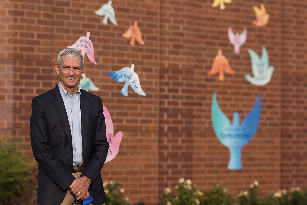 Michael R. Lovell, 57, president of Marquette University in Milwaukee, died June 9, 2024, in Italy while on a Jesuit formation pilgrimage with members of the Society of Jesus and the Jesuit university's board of trustees. Lovell, pictured in a 2020 photo outside of the Alumni Memorial Union building on the Marquette campus, had been battling sarcoma, a rare form of cancer, for three years. Lovell was the first lay president in the Jesuit school's 133-year history. (OSV News/Sam Lucero)