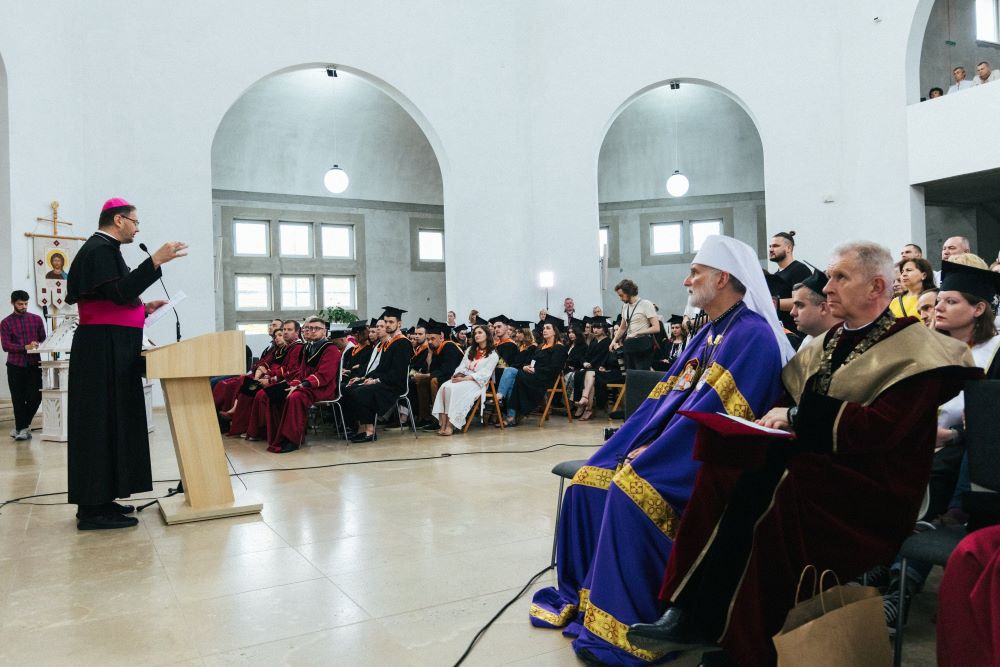 Archbishop Visvaldas Kulbokas, papal nuncio to Ukraine, addresses graduates of Ukrainian Catholic University in Lviv during a Divine Liturgy and commencement exercises July 2, 2023, at the school's Church of St. Sophia, Wisdom of God. (OSV News/Ukrainian Catholic University)        