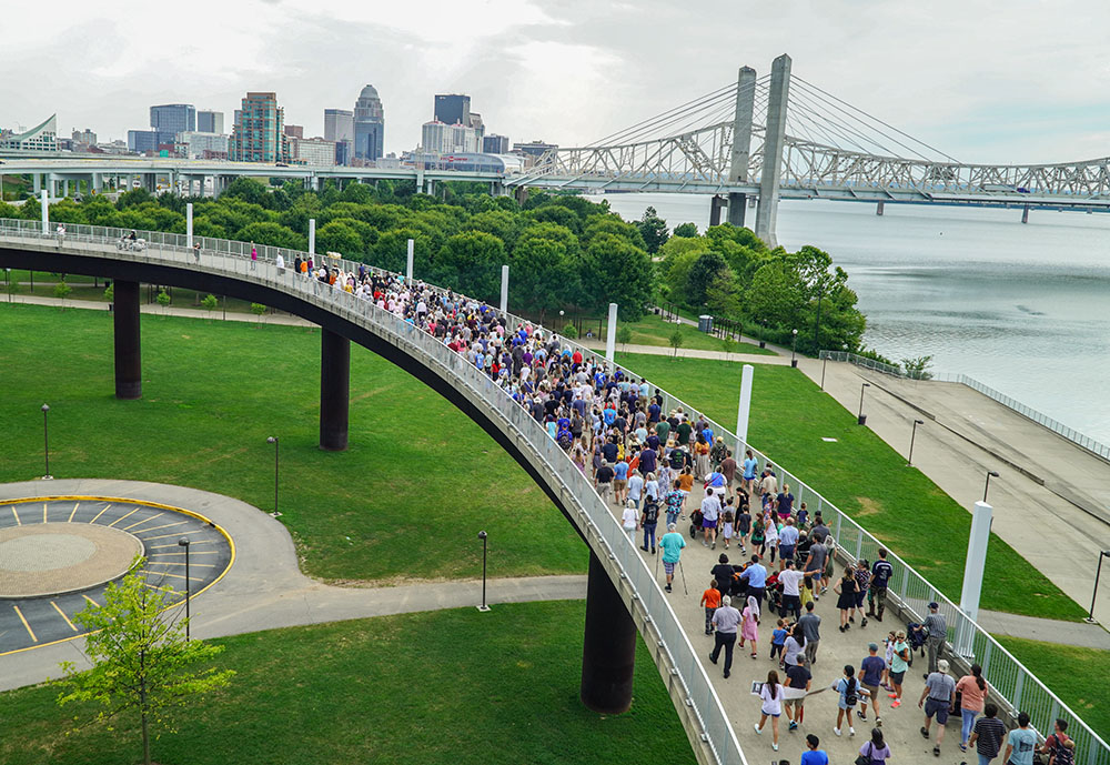 Hundreds of local Catholics processed with the Blessed Sacrament carried by Archbishop Shelton Fabre of Louisville, Kentucky, July 9 on the Louisville ramp to the Big Four Bridge. The bridge for pedestrians and cyclists connects Louisville to Jeffersonville, Indiana. The procession marked the end of the National Eucharistic Pilgrimage's July 4-9 route through the Louisville Archdiocese. (OSV News/The Record/Marnie McAllister)