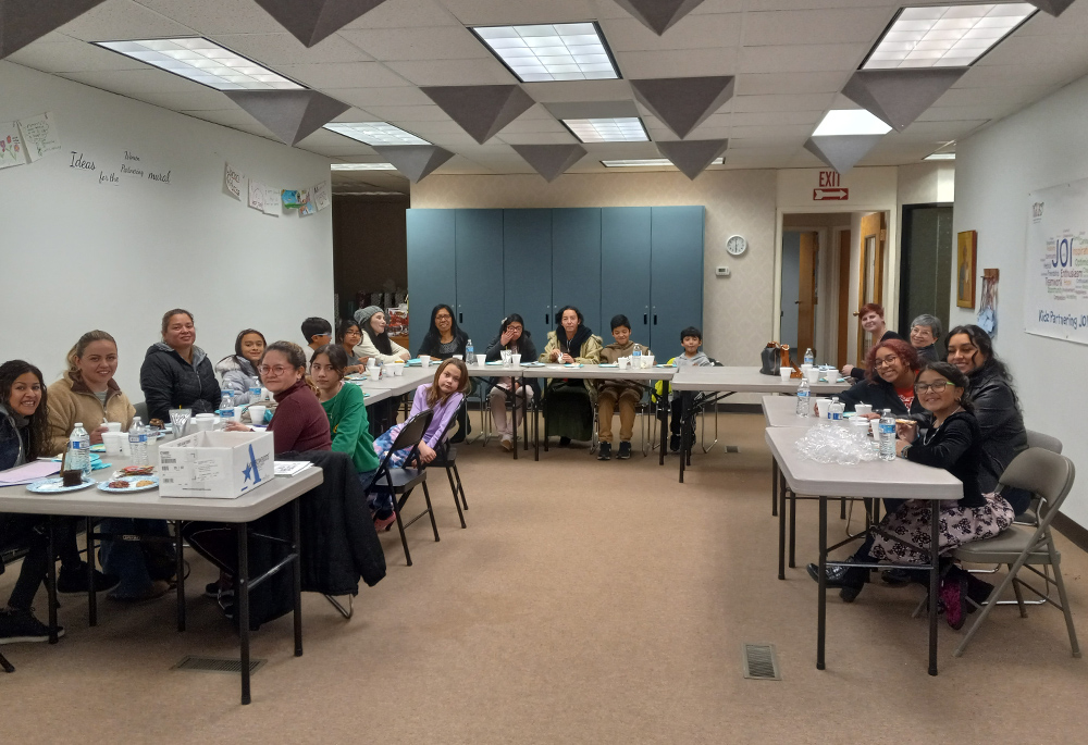 Clients of Women Partnering and their families participate in a holiday activity at the nonprofit. Women Partnering provides financially vulnerable women with the tools and support to achieve economic sustainability and overall independence. (Courtesy of Women Partnering)