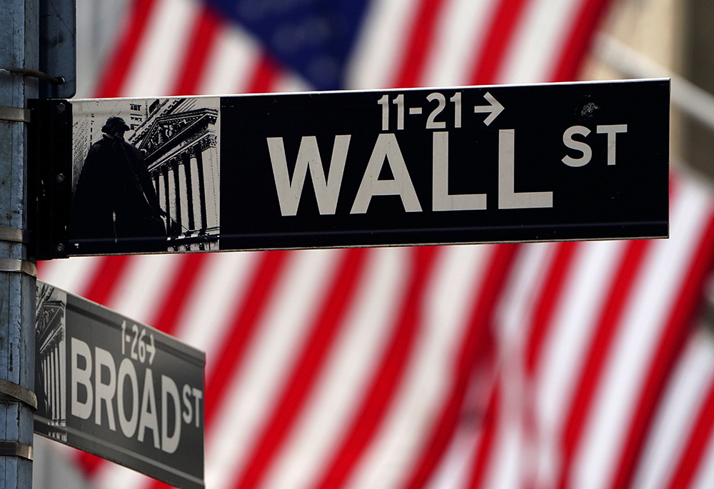 The Wall Street sign is pictured outside the New York Stock Exchange April 16, 2021, in New York City. (OSV News/Reuters/Carlo Allegri)