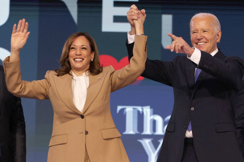 U.S. President Joe Biden and Democratic presidential candidate and U.S. Vice President Kamala Harris gesture during the Democratic National Convention.