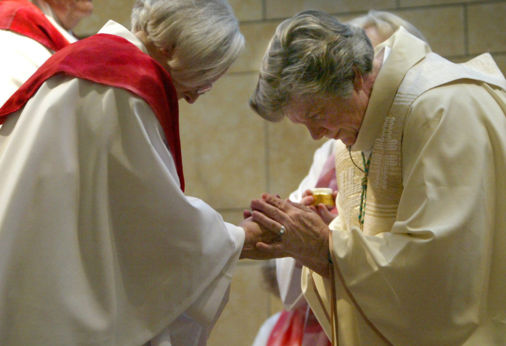 Patricia Fresen, right, greets Elsie Hainz McGrath during a ceremony at which Fresen ordained McGrath and another woman at the Central Reform Congregation Synagogue in St. Louis in this Nov. 11, 2007, file photo. Women Called to Catholic Priesthood shares stories of women who followed their call to priesthood through ordination. (CNS photo/Karen Elshout)