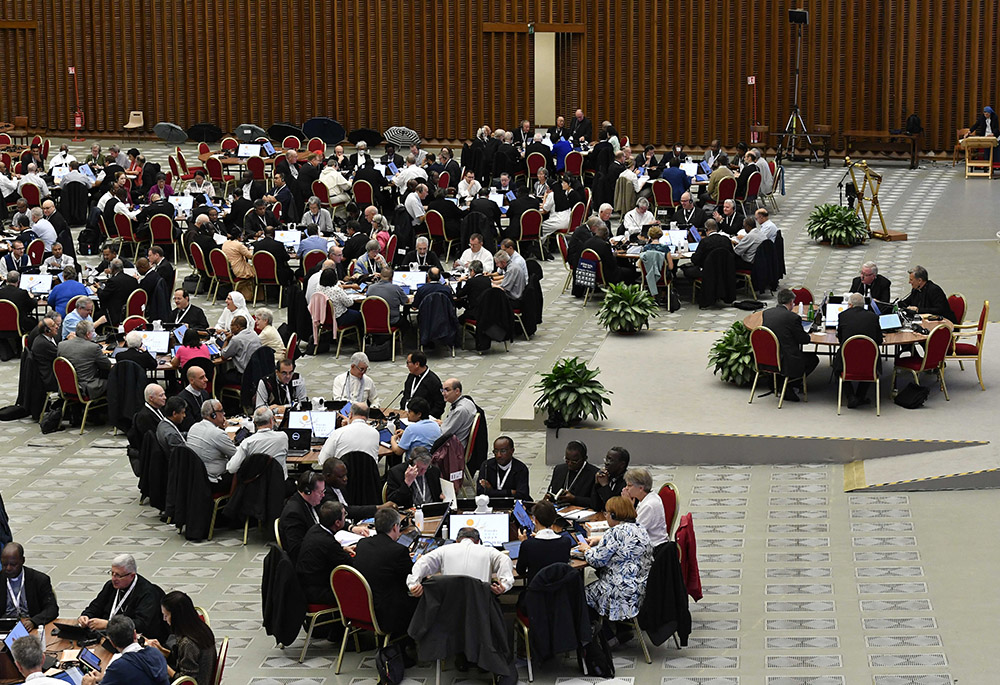 Pope Francis and participants begin a working session of the assembly of the Synod of Bishops in the Vatican's Paul VI Audience Hall, Oct. 13, 2023. (CNS/Lola Gomez)