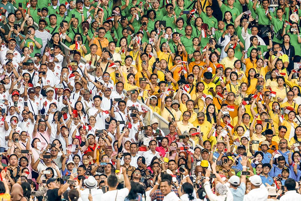 People cheer as Pope Francis arrives at Gelora Bung Karno Stadium in Jakarta, Indonesia, to celebrate Mass Sept. 5. (CNS/Lola Gomez)