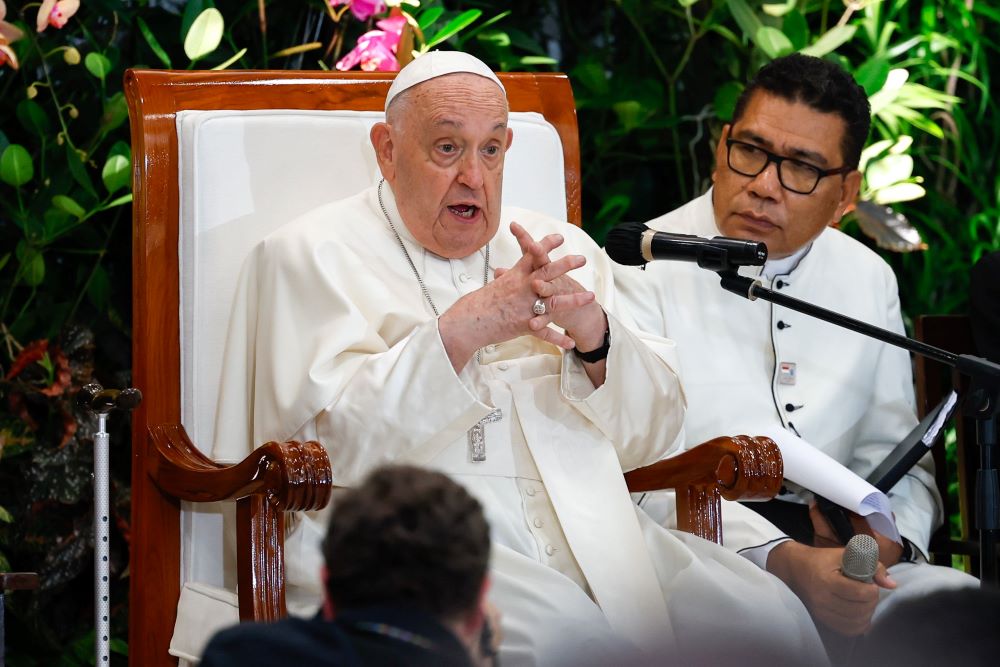 Pope Francis gestures as he talks to young people in Jakarta, Indonesia, Sept. 4.