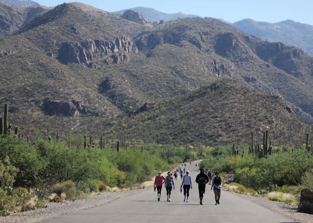 People walk through Sabino Canyon Recreation Area in Tucson, Arizona.