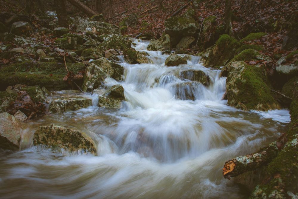 Water flows through rocks.