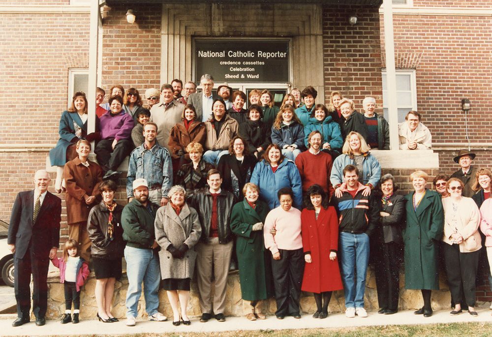 The staff of the National Catholic Reporter Publishing Company is pictured in this 1994 Christmas photo, taken outside the company's headquarters in Kansas City, Missouri. A new book outlines the 60-year history of the company. (NCR file photo)