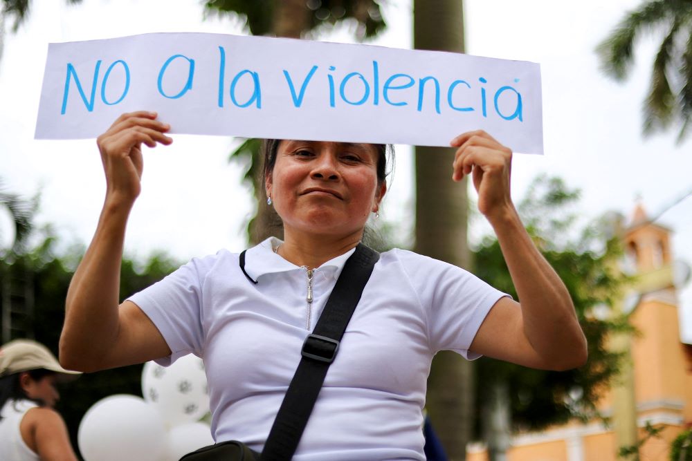 A woman holds a sign reading, "No To Violence," during a demonstration June 19 in Yajalon, in Mexico's Chiapas state. ors were demanding government authorities guarantee their safe return to their communities, such as the town of Tila, which people have fled due to armed gang violence. (OSV News/Reuters/Jacob Garcia)