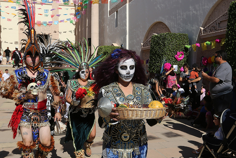 Aztec dancers participate in the Dia de los Muertos (Day of the Dead) celebration at Calvary Cemetery in Los Angeles Nov. 1, 2015. (CNS/Archdiocese of Los Angeles/Victor Aleman)