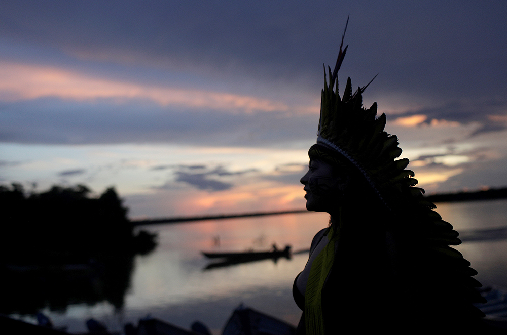 A leader of the Celia Xakriaba peoples walks along the banks of the Xingu River in Brazil's Xingu Indigenous Park Jan. 15, 2020. (CNS/Reuters/Ricardo Moraes)