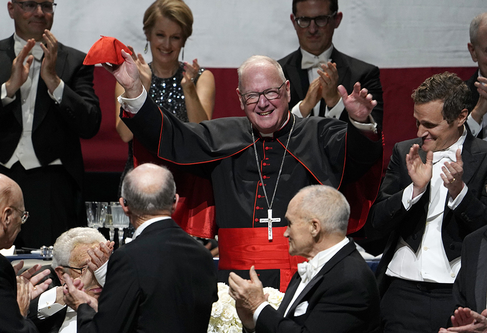 New York Cardinal Timothy Dolan waves to the audience after being introduced at the 78th annual Alfred E. Smith Memorial Foundation Dinner at the Park Avenue Armory in New York City, on Oct. 19, 2023. (OSV News/Gregory A. Shemitz)