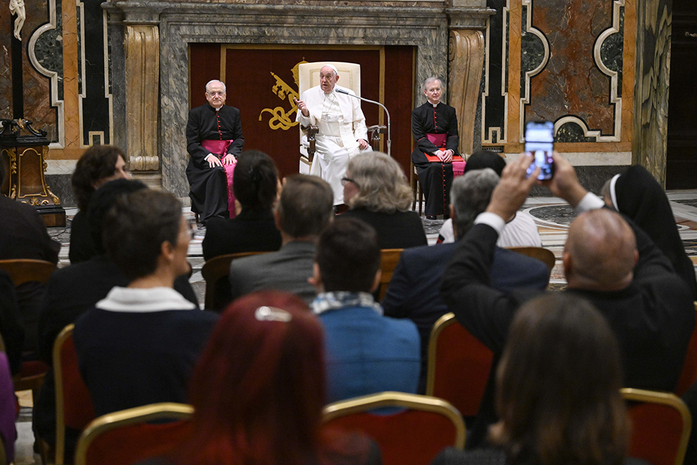 Pope Francis speaks with lay women and men participating in or assisting the Synod of Bishops in the Apostolic Palace at the Vatican Oct. 19, 2024. (CNS/Vatican Media)