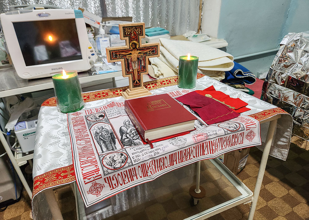 At a triage center in Velykomykhajlivka in southeastern Ukraine, Fr. Aleksandr Bohomoz and Basilian Sr. Lucia Murashko placed the sacred vessels needed for Mass, or, as the Ukrainians call it, the Divine Liturgy, on a medical table. (NCR photo/Chris Herlinger)