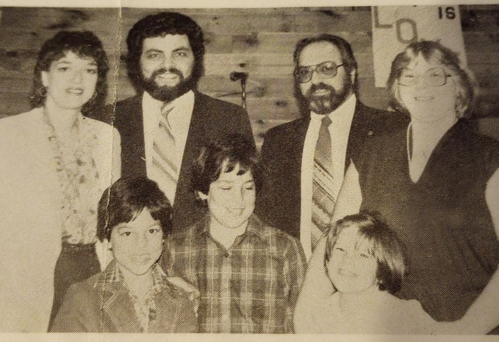 Matthew LaBanca (bottom left) is pictured in 1982 after a Sunday Mass at Sacred Heart Church in Patterson, New York, with his mom, dad, older brother and the Monaco family, all part of a folk family choir. LaBanca's love and aptitude for music, theater and dance were nurtured when he was young, often amid his Catholic faith community. (Courtesy of Matthew LaBanca)