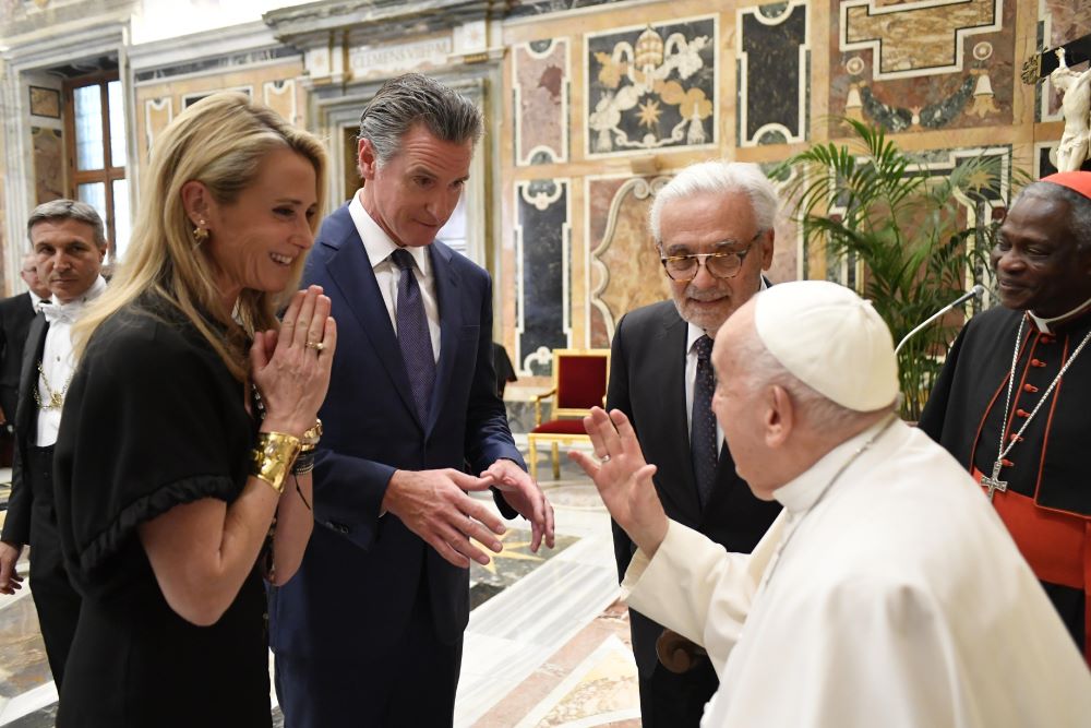 Pope Francis greets California Gov. Gavin Newsom and Jennifer Siebel Newsom.