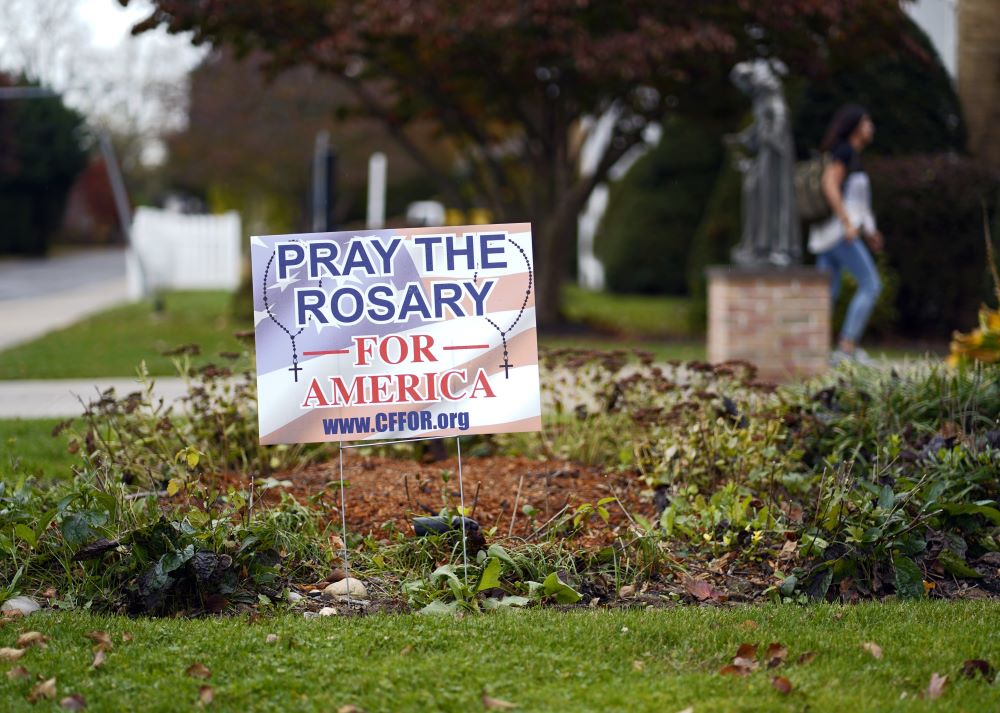 A lawn sign produced by Catholics for Freedom of Religion is seen outside Sts. Philip and James Church in St. James, N.Y., Nov. 1. 