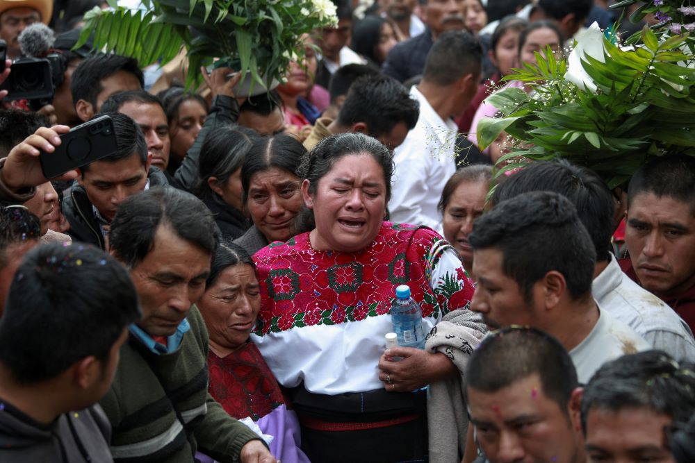 Mourners become emotional during the burial of Fr. Marcelo Pérez in San Andrés Larrainzar in the southern state of Chiapas, Mexico, Oct. 22. 