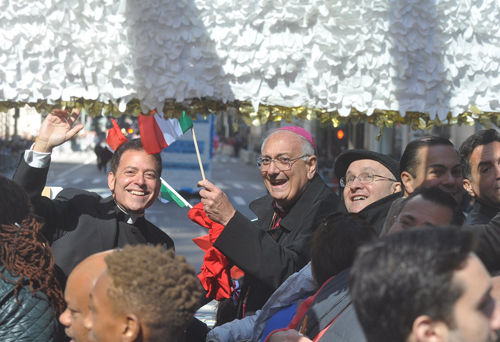 Msgr. Jamie Gigantiello, left, former director of development for the Diocese of Brooklyn, New York, is pictured on a 2016 Columbus Day float in Brooklyn with now retired Brooklyn Bishop Nicholas DiMarzio. (CNS photo/The Tablet/Ed Wilkinson)