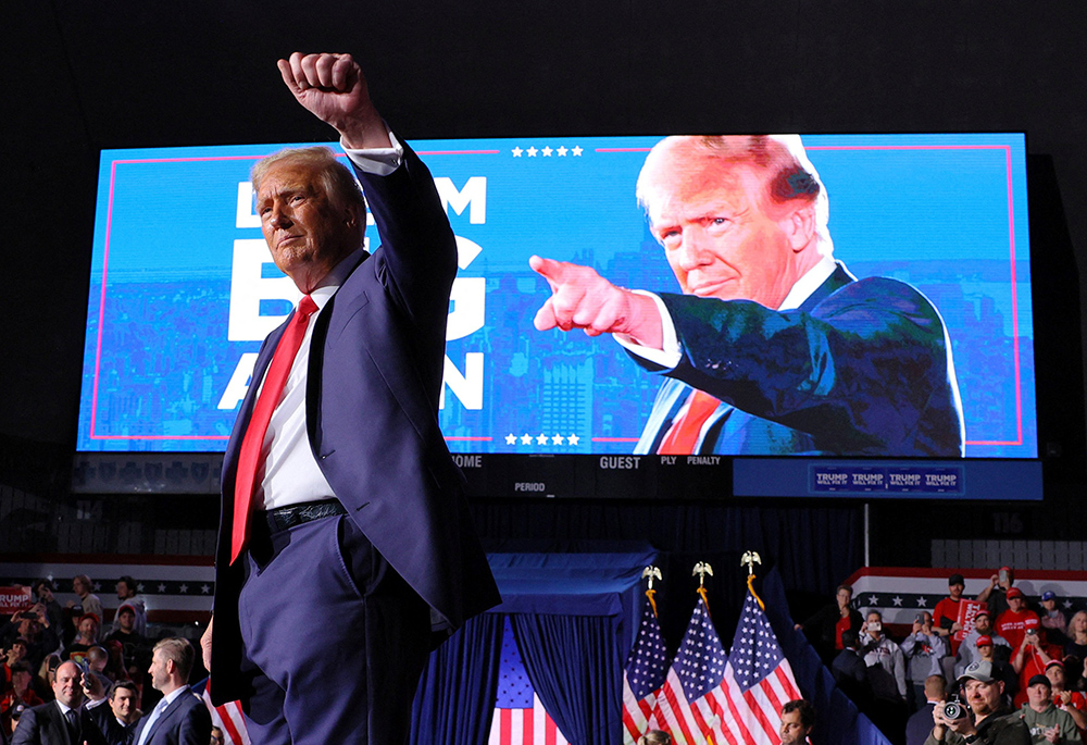 Republican presidential nominee and former U.S. President Donald Trump gestures to the crowd at the conclusion of his final campaign rally on Election Day, Nov. 5, at Van Andel Arena in Grand Rapids, Michigan. Trump garnered the 270 electoral votes needed to clinch the presidency. (OSV News/Reuters/Brian Snyder)