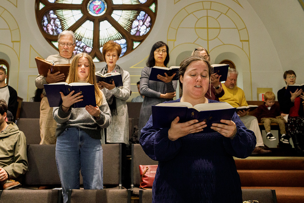 Choir members perform at Sacred Heart Catholic Church during morning Mass in Columbia, Missouri, on Sunday, Nov. 3. (Artem Baidala)