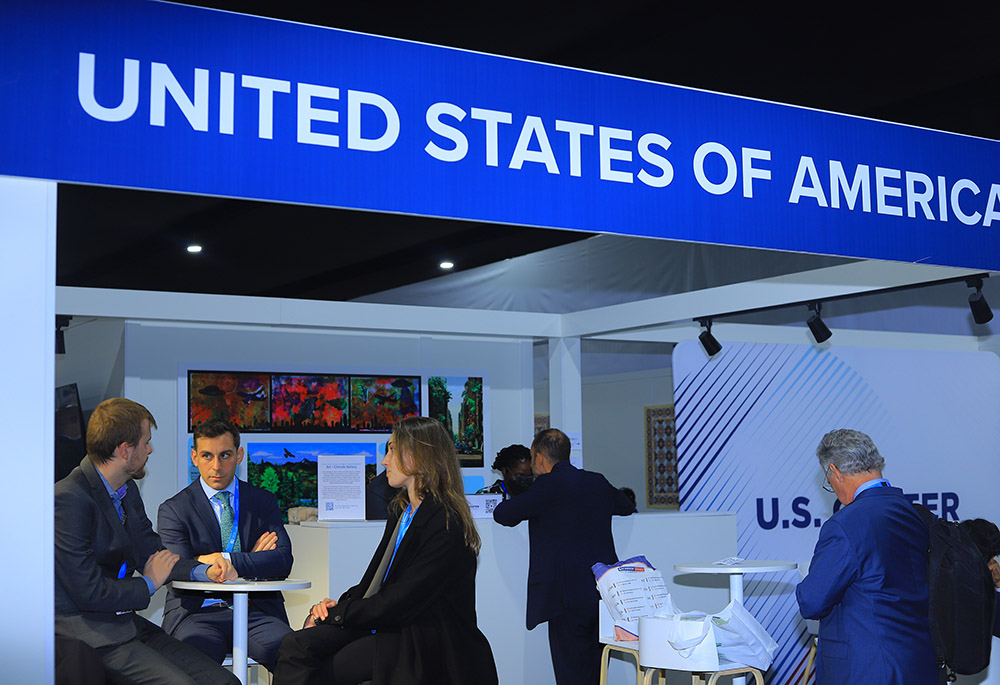 Delegates engage in discussions at the United States of America’s pavilion during COP 29 in Baku, Azerbaijan, Nov. 11-22. (NCR photo/Doreen Ajiambo)