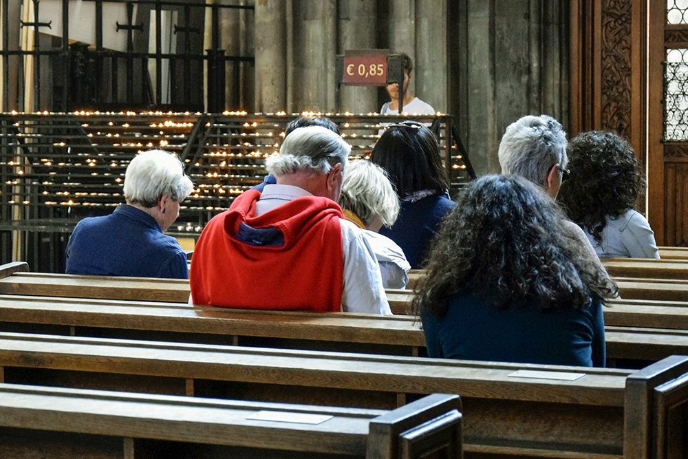 Parishioners pray during Mass at a Catholic church in Vienna in May 2019. Many of the recommendations from the final report of the 2021-24 synod on synodality are already being practiced, the Austrian bishops said in a statement, not least through the 40,000 elected members working in the church's parish councils and asset management boards. (Dreamstime/Marina Novitkaia)