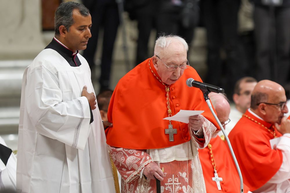 Cardinal Angelo Acerbi, a former Vatican diplomat, thanks Pope Francis on behalf of himself and the 20 other new cardinals created during a consistory Dec. 7 in St. Peter's Basilica at the Vatican. At 99, Acerbi is ineligible to participate in a papal conclave. (CNS/Lola Gomez)