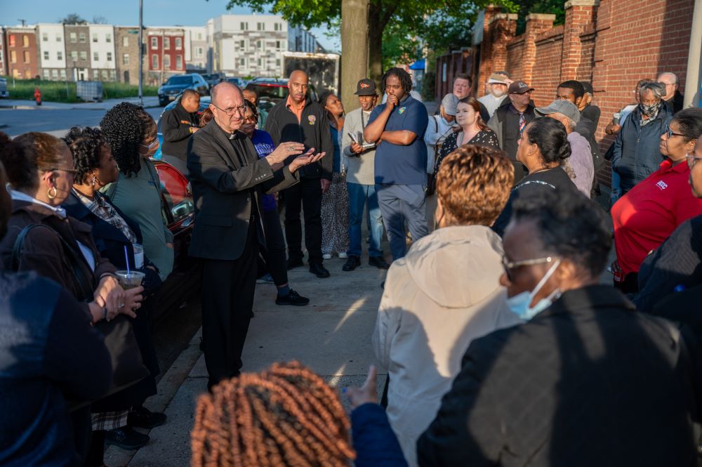 Auxiliary Bishop Bruce Lewandowski speaks to an overflow crowd attending a Seek the City To Come meeting for the Black Catholic community April 23. 