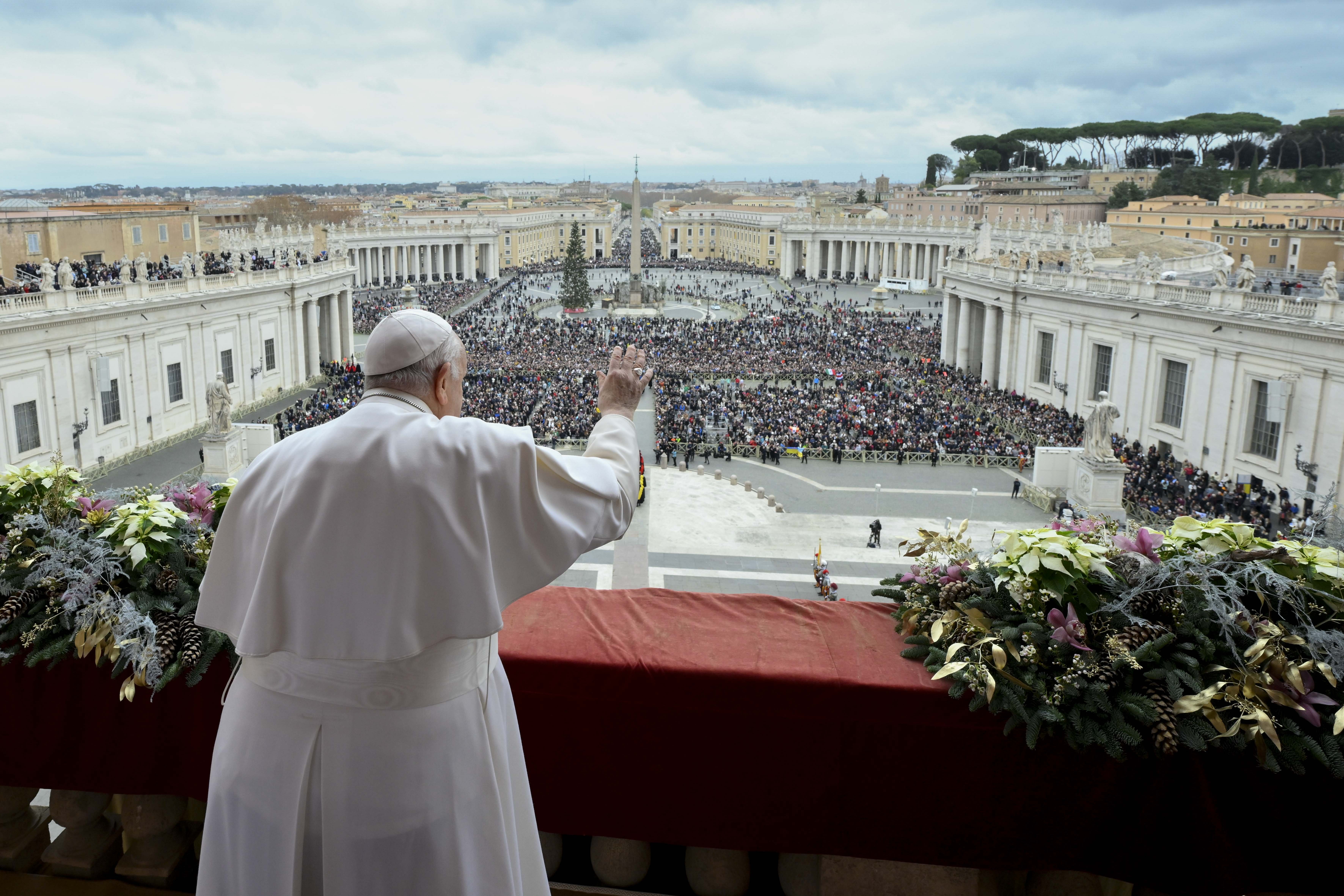 Pope Francis waves to an estimated 70,000 people gathered in St. Peter's Square at the Vatican for his Christmas blessing "urbi et orbi" (to the city and the world) Dec. 25, 2023. (CNS photo/Vatican Media)