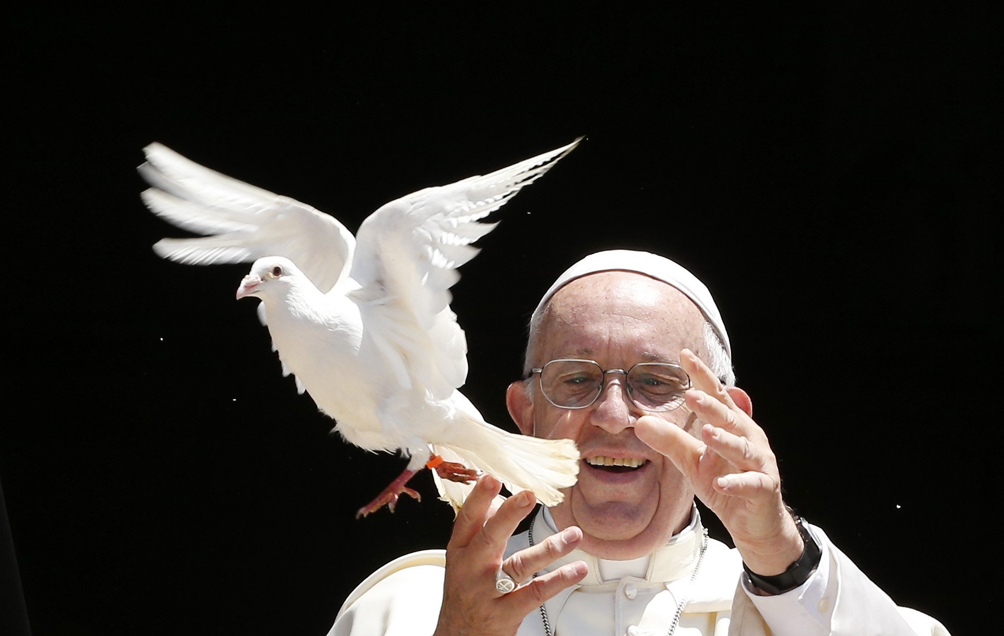 Pope Francis releases a dove outside the Basilica of St. Nicholas after meeting with the leaders of Christian churches in Bari, Italy, July 7. The pope met Christian leaders for an ecumenical day of prayer for peace in the Middle East. (CNS photo/Paul Haring)