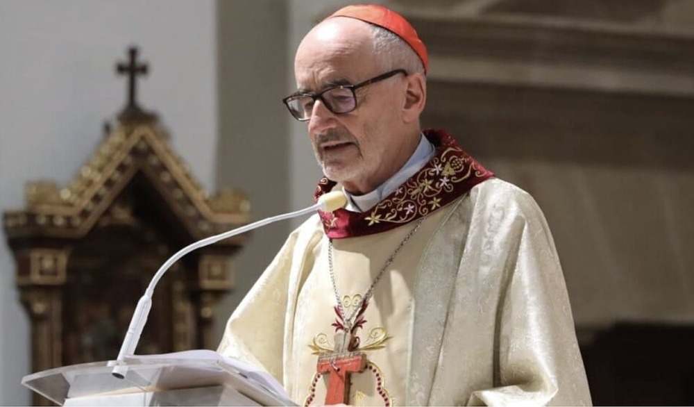 The Cardinal, vested for mass, stands preaching.