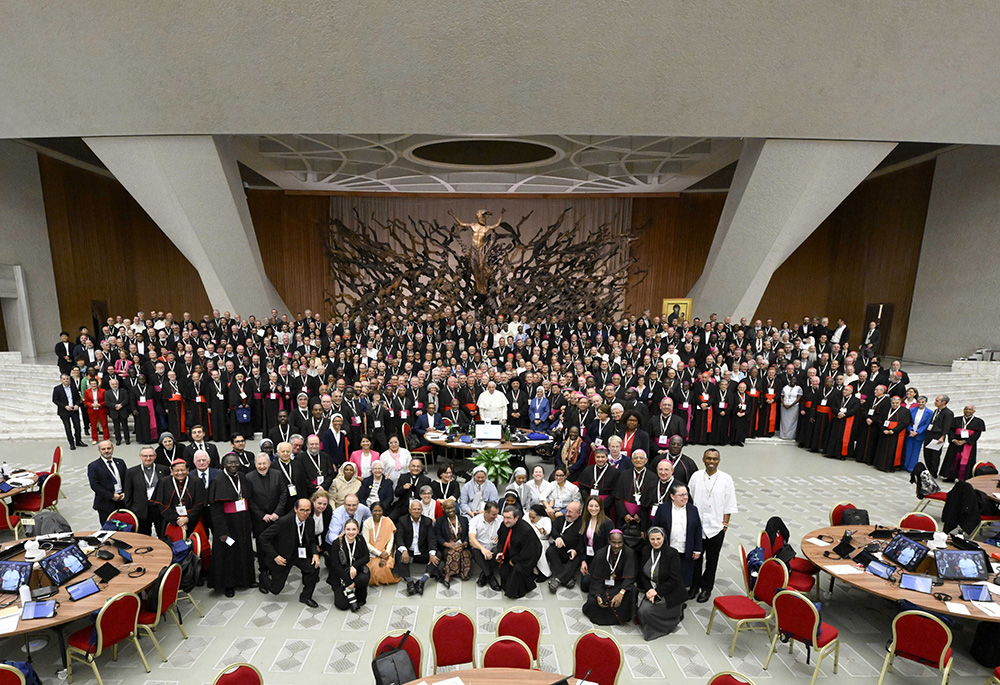 Pope Francis and members of the Synod of Bishops on synodality pose for a photo after the synod's final working session, Oct. 26 in the Paul VI Audience Hall at the Vatican. (CNS/Vatican Media)