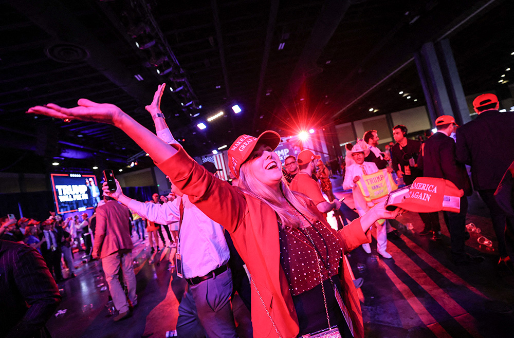 A supporter of Republican President-elect Donald Trump celebrates at his victory rally at the Palm Beach County Convention Center in West Palm Beach, Fla., Nov. 6, 2024, after Trump was elected the 47th president of the United States. (OSV News/Reuters/Carlos Barria)