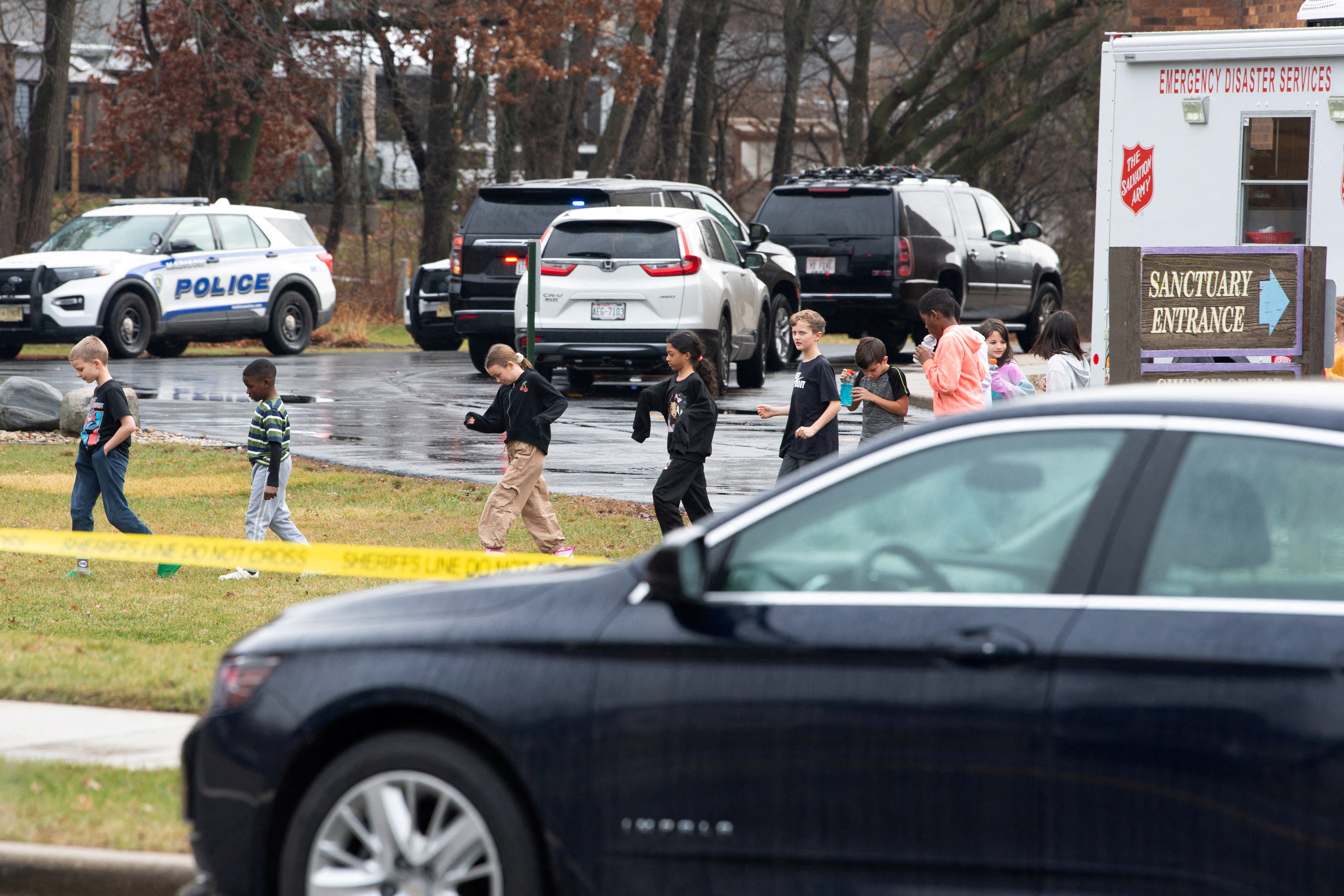 Children prepare to board a bus bound for the reunification center where they'll meet their parents after a mass shooting at Abundant Life Christian School in Madison, Wis., Dec. 16, 2024. At least two people are dead, in addition to the suspect, and others are injured, after the mass shooting, police said. (OSV News photo/Cullen Granzen, Reuters)