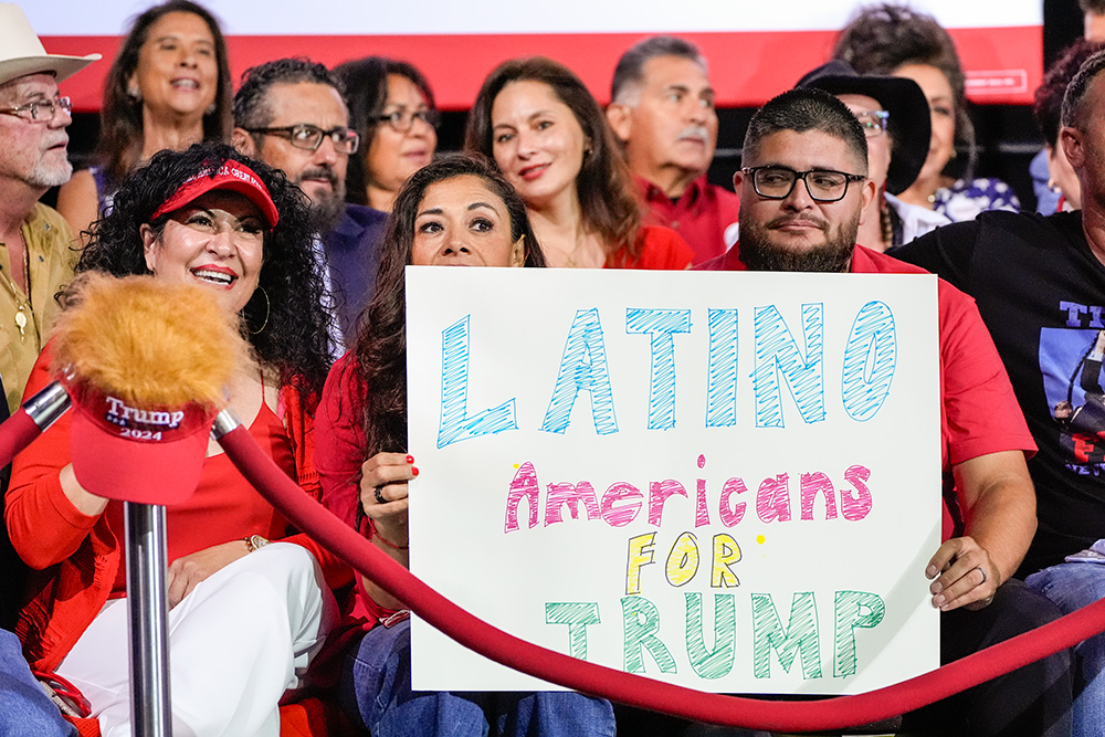 Supporters hold a sign before Republican presidential nominee former President Donald Trump arrives to speak during a campaign event Sept.12, 2024, in Tucson, Ariz. (AP/Alex Brandon, File)